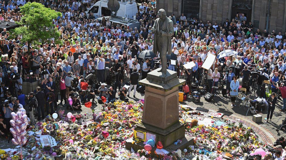People gather for minute's silence at St Ann's square