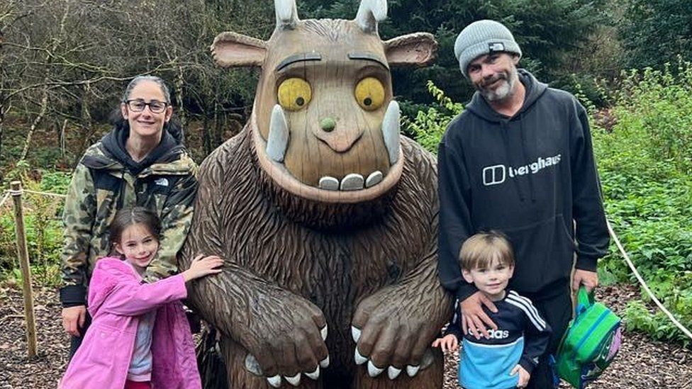 John McKeown and his family pose with gruffalo statue