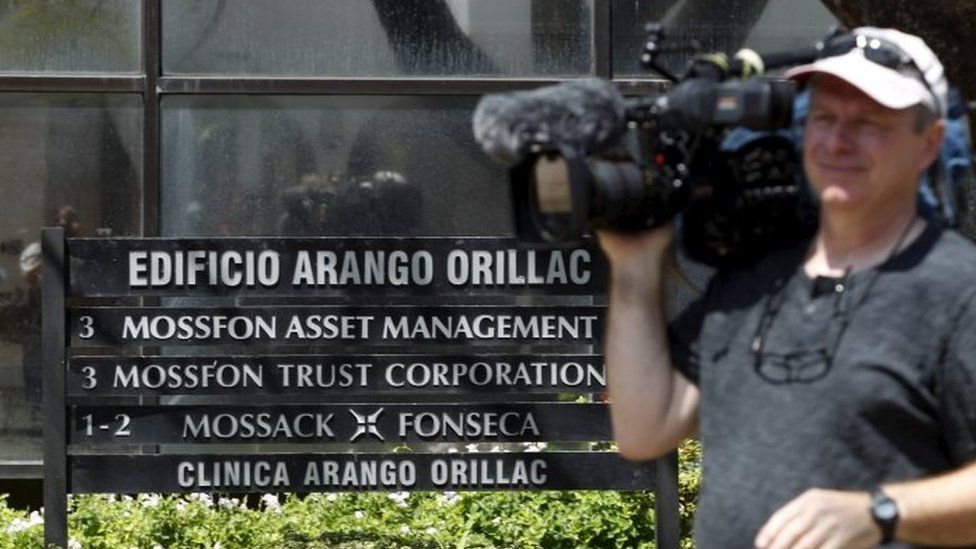 A cameraman is seen outside the Arango Orillac Building where Mossack Fonseca law firm is situated in Panama City (05 April 2016)