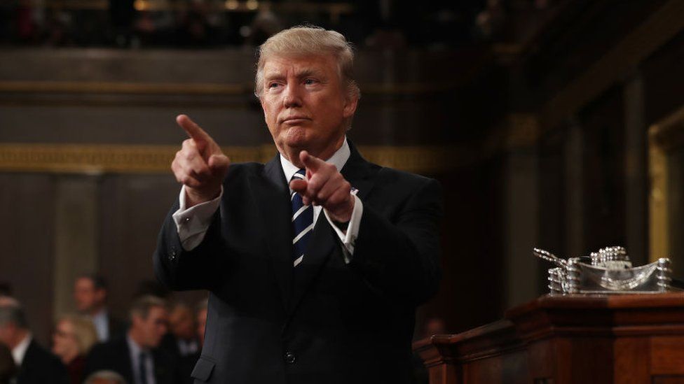 Donald Trump points before his address to Congress.