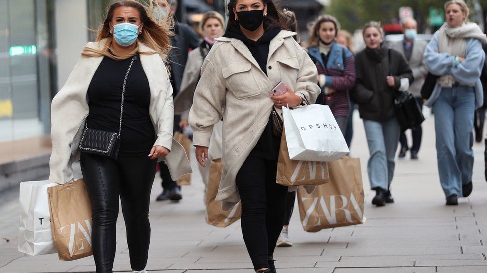 Shoppers wearing face coverings