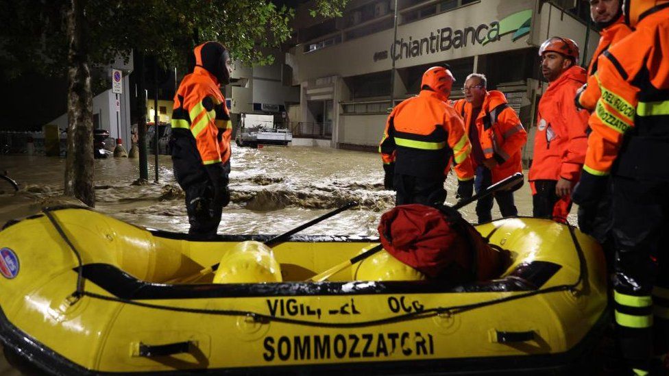 Rescuers use inflatable boats to recover people after flooding in Campi Bisenzio, Italy, 03 November 2023