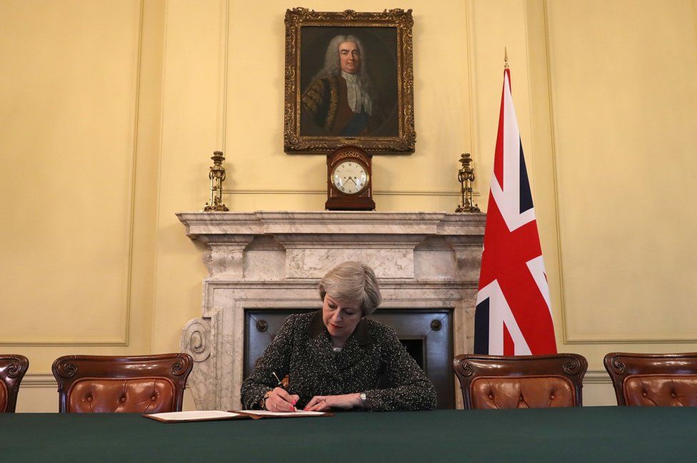 Theresa May signs the letter which will trigger Article 50, confirming the UK's departure from the EU.