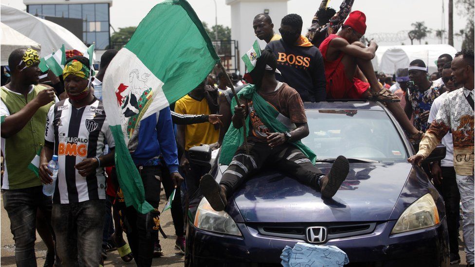 End Sars protesters on a car with a Nigerian flag in Lagos, Nigeria 1- October
