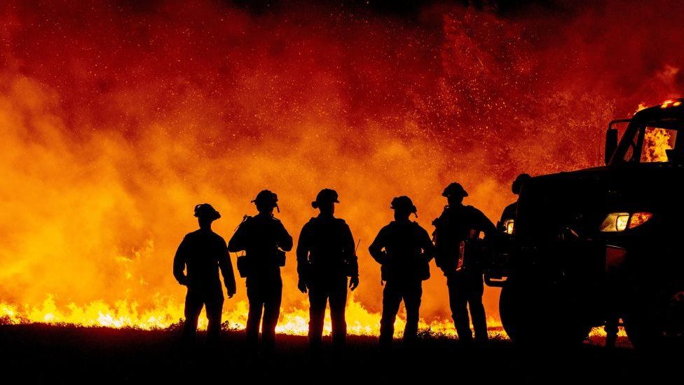 Firefighters in front of California wildfire