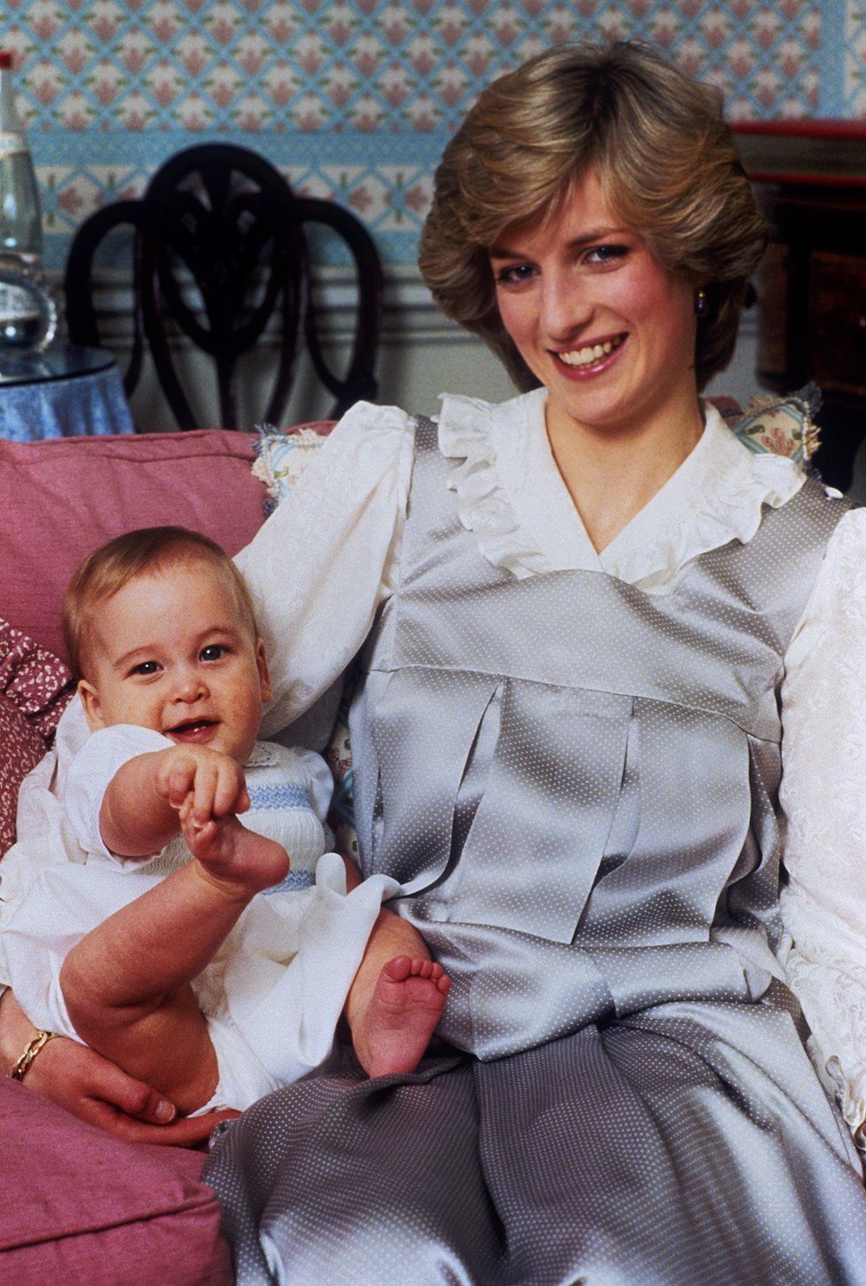 A baby Prince William with his mother, The Princess of Wales, at home in Kensington Palace, London