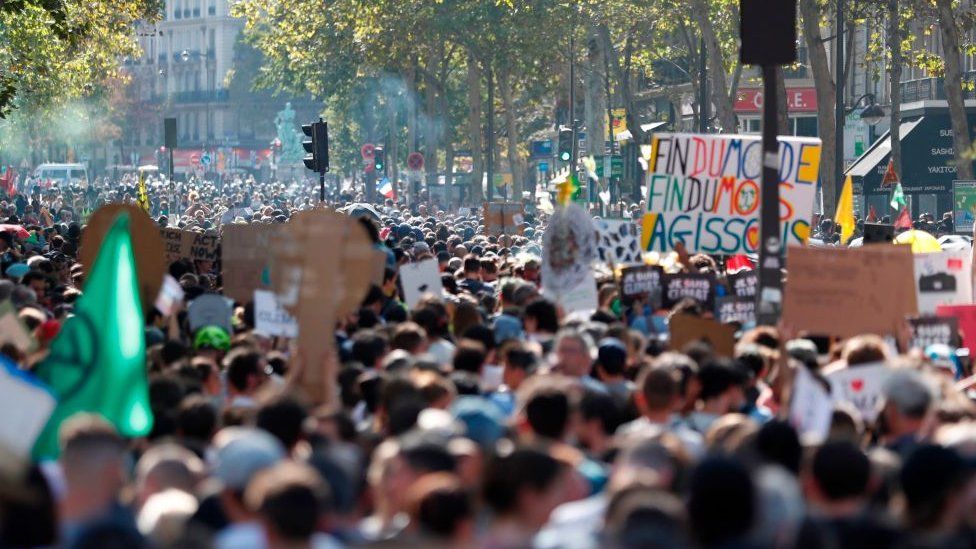 The climate change march gathered on the Champs Elysees