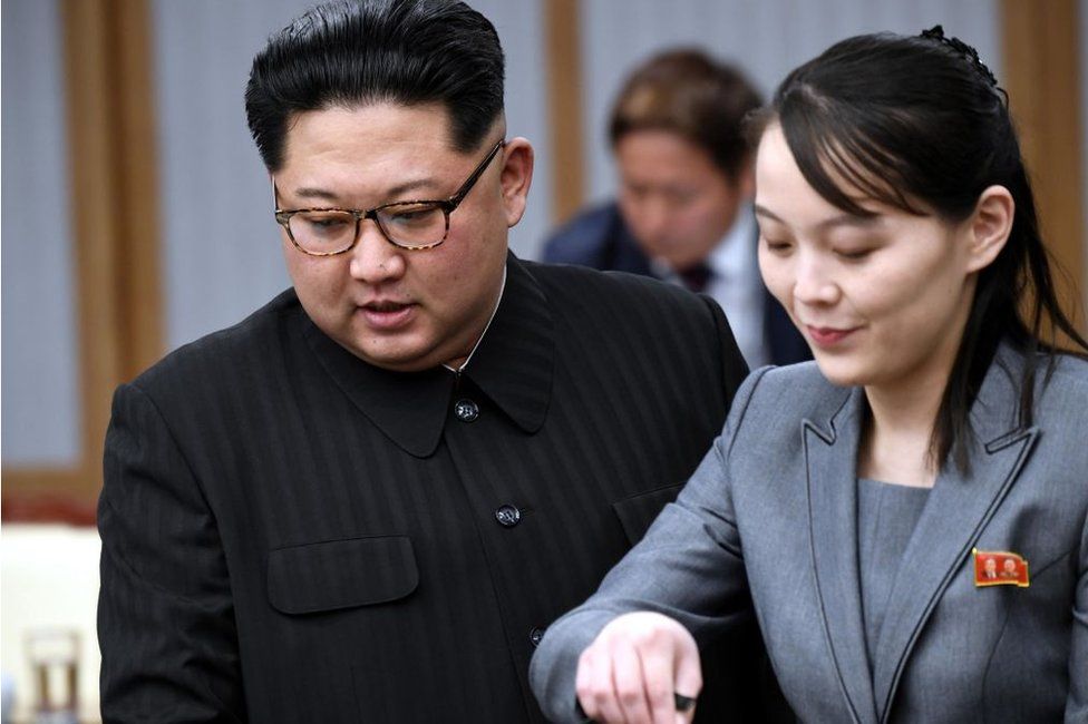 North Korean leader Kim Jong Un (L), alongside Kim Yo Jong, his sister and a senior official of the ruling Workers' Party, attends a meeting with South Korean President Moon Jae In