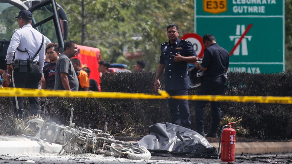 Authorities inspect the scene of a plane crash near Elmina, Malaysia August 17, 2023