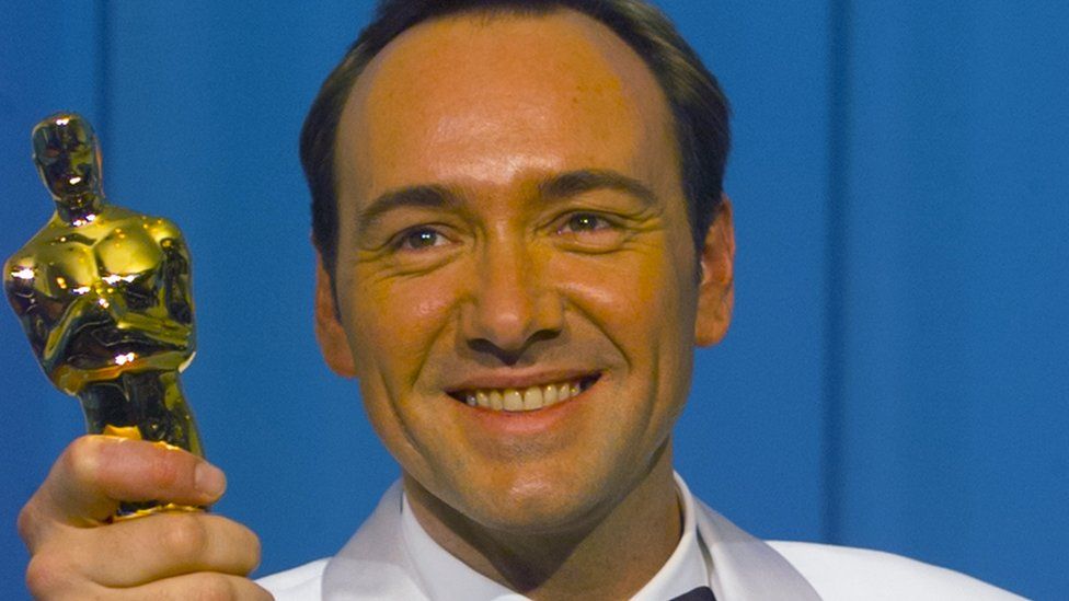 Actor Kevin Spacey holding his Oscar trophy for best supporting actor for his role in The Usual Suspects in 1996