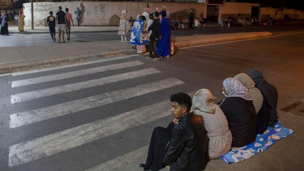 People seek safety outside in Rabat after the earthquake