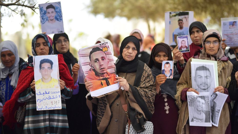Demonstrators hold placards of young missing Moroccans outside the EU Delegation office in Rabat, Morocco - Friday 24 February 2023