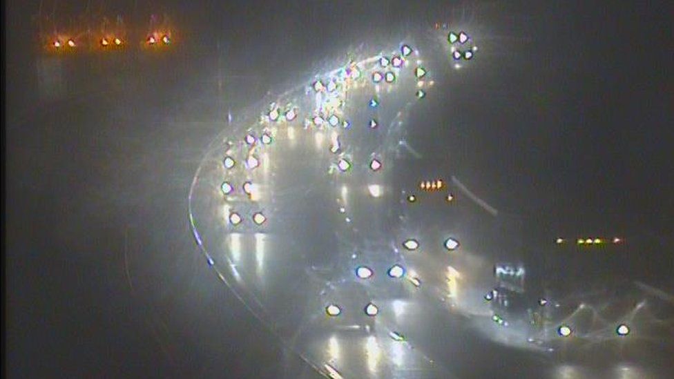 Traffic queuing on M4 after three-lorry crash