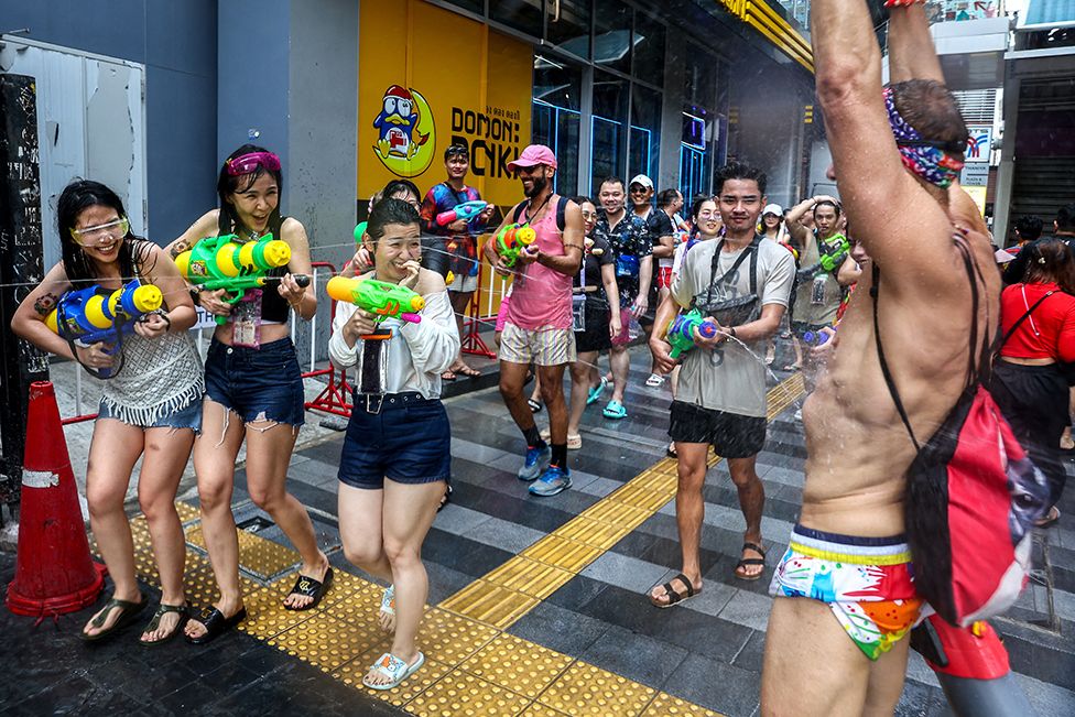 People celebrate the Songkran holiday in Bangkok, Thailand, marking the Thai New Year on 13 April 2023