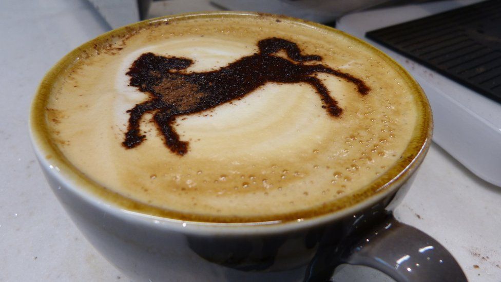 coffee with a black horse on top