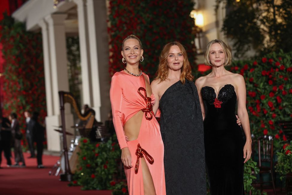 Poppy Delevingne, Stella McCartney and Carey Mulligan pose for a photo as they attend Vogue World