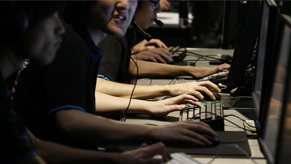 Gamers taking part in esports competition