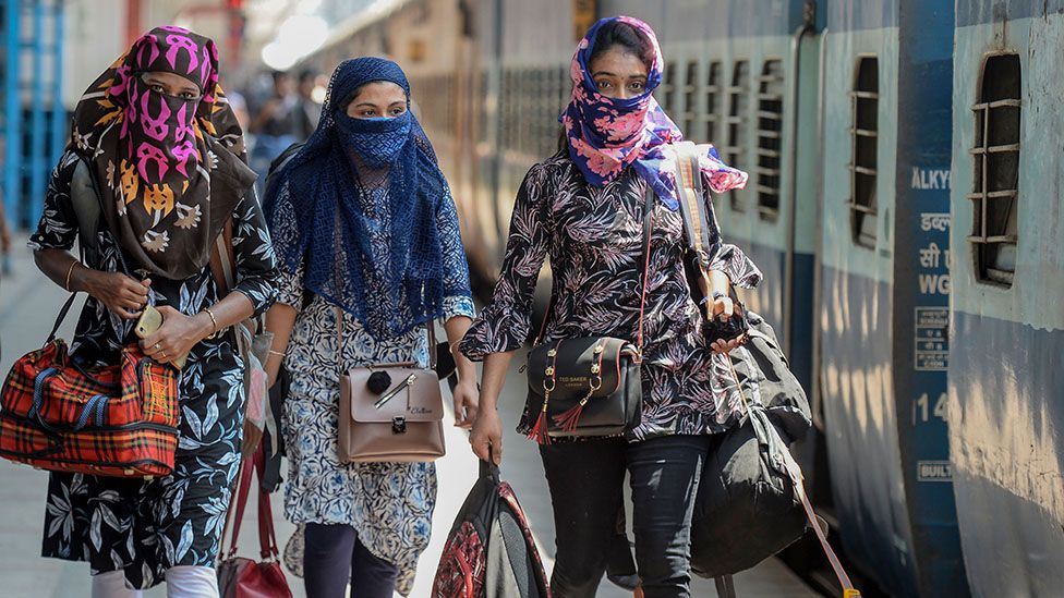 Women in India with faces covered