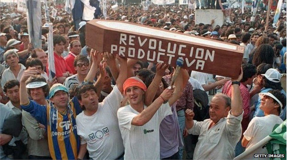 Demonstrators in Buenos Aries carrying a coffin as part of demonstration