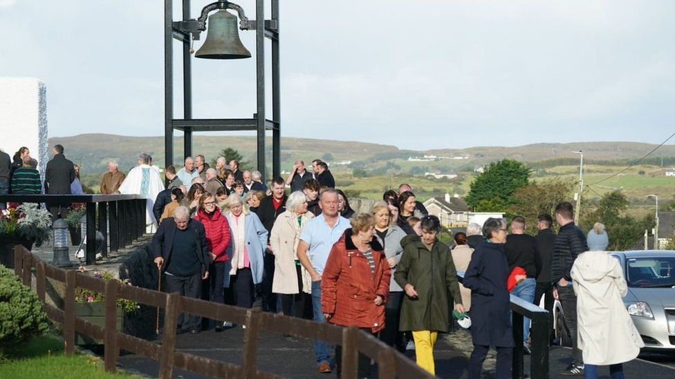 People coming out of Saturday morning mass at the church in Creeslough