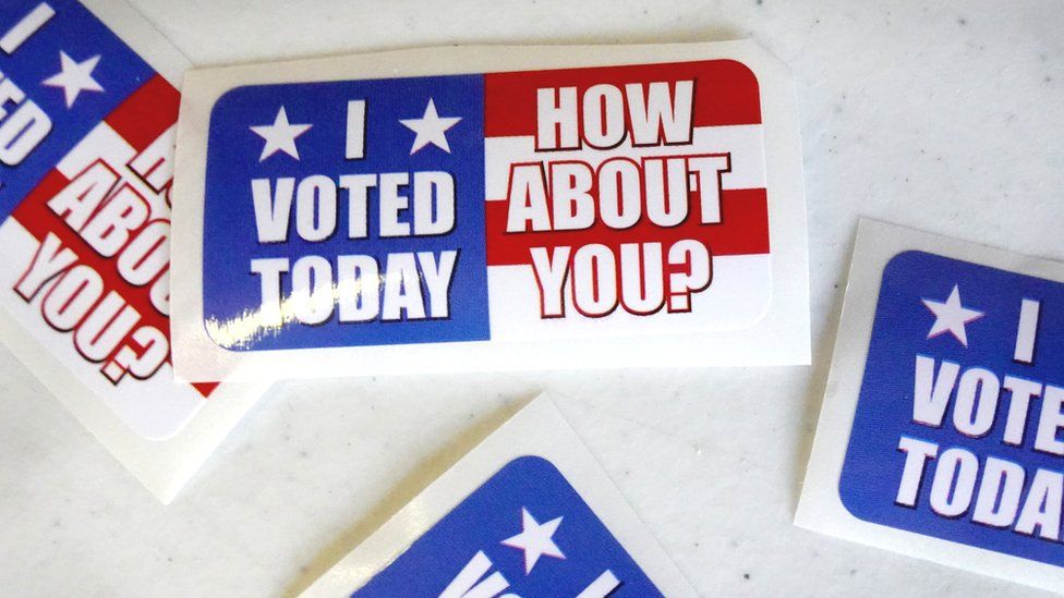Stickers sit on a table at the Wicker Park Social Center polling place during the first day of early voting in Indiana on October 06, 2020 in Highland, Indiana.