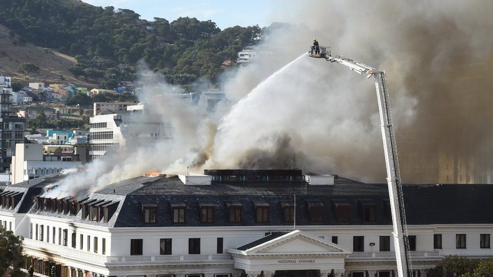 Firefighters battle against the blaze
