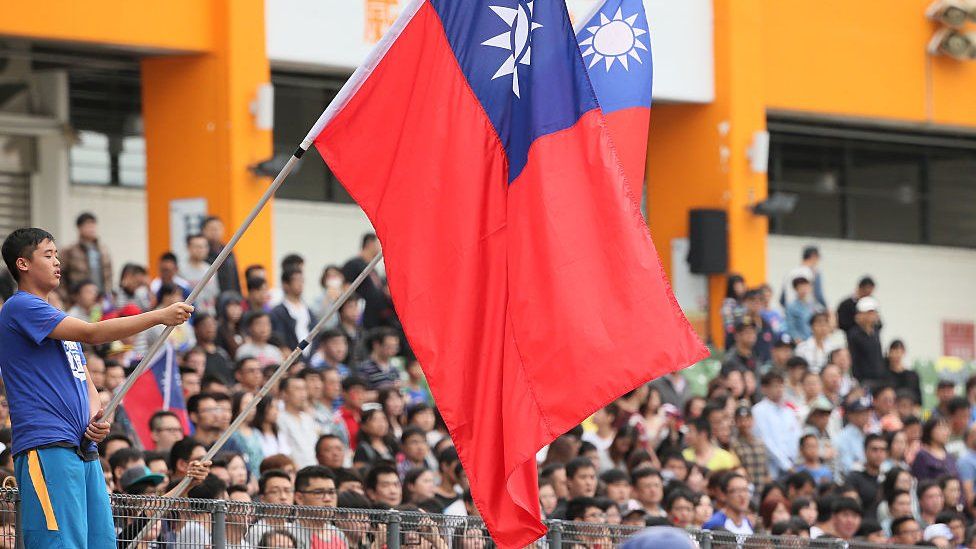 A Fan of Chinese Taipei holds a national flag