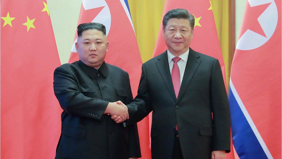 This file photo taken on January 8, 2019 and released on January 10 by North Korea's official Korean Central News Agency (KCNA) shows North Korea's visiting leader Kim Jong Un (L) shaking hands with China's President Xi Jinping (R) during a welcome ceremony at the Great Hall of the People in Beijing