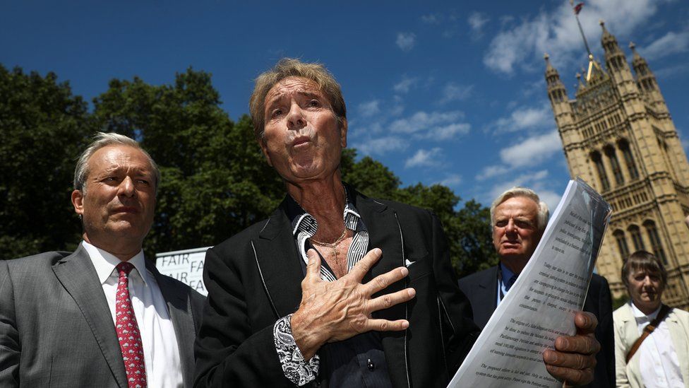 British singer Cliff Richard speaks to members of the media during a press conference near the Houses of Parliament in London, Britain