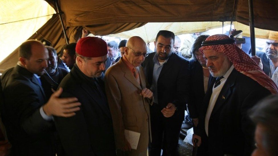 Gerald Kaufman (3rd L), the head of a European Parliament delegation, meets with residents of Jabalia"s Ezbet Abed Rabbo district