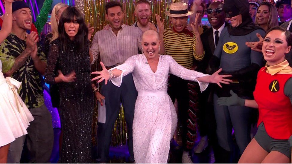 Amy Dowden surrounded by this year's Strictly Come Dancing cast during her surprise appearance