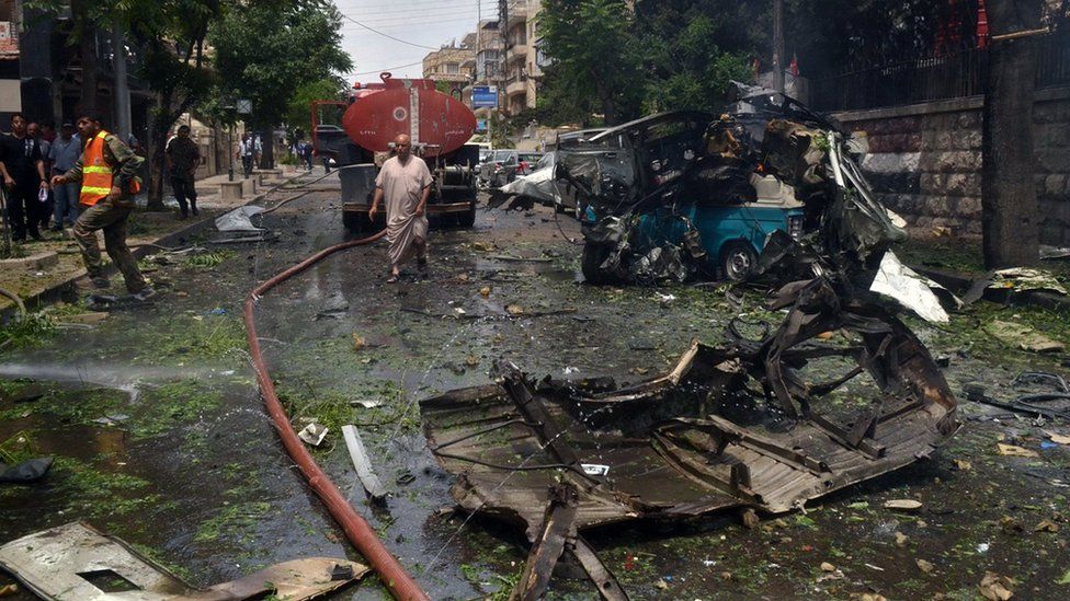 Scene of rocket strike in the central neighbourhood of Muhafaza in Aleppo, Syria, Tuesday, May 3