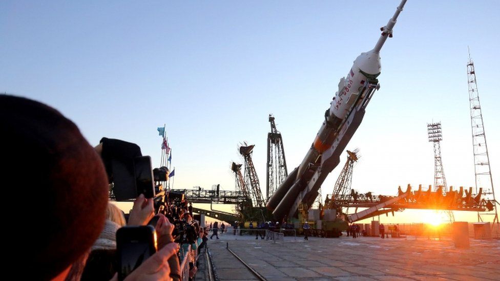 Tourists photograph a rocket on a launch pad at Baikonur Cosmodrome in 2015 which would carry Tim Peake to the International Space Station