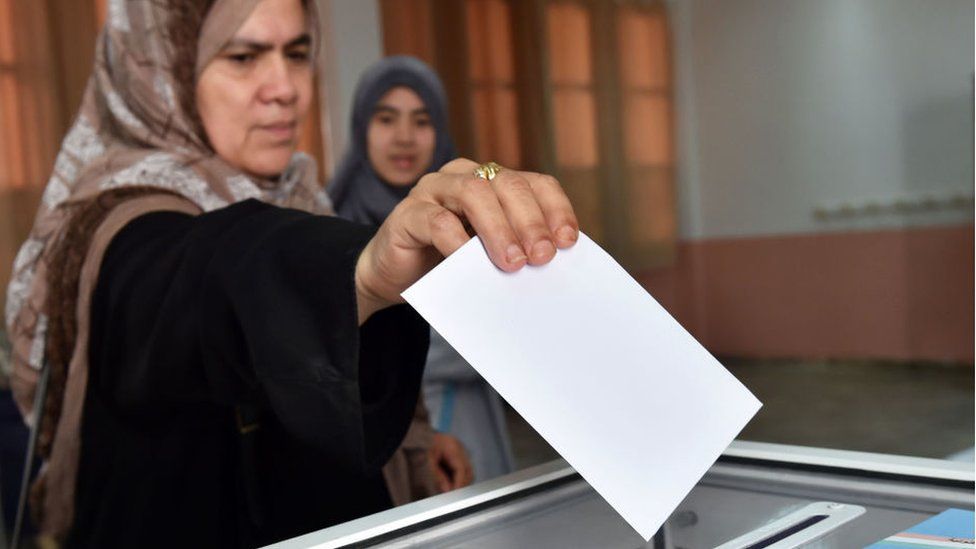 An Algerian woman casts her vote in parliamentary elections in 2017.