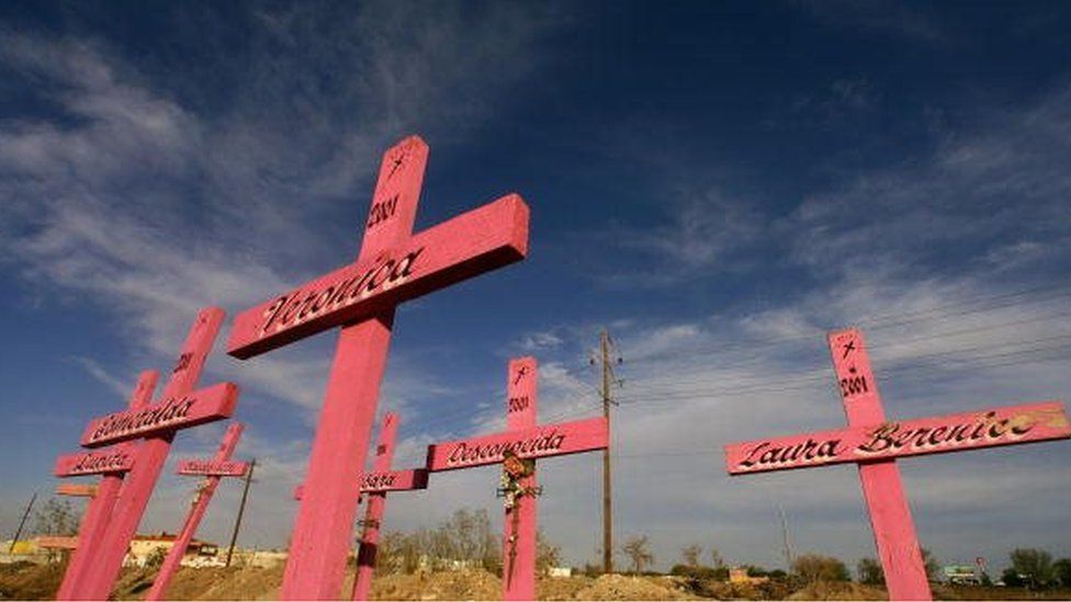 Wooden crosses are seen in the place where the corpses of eight murdered women were found in 2001 in Ciudad Juarez, Chihuahua, 11 April 2006.