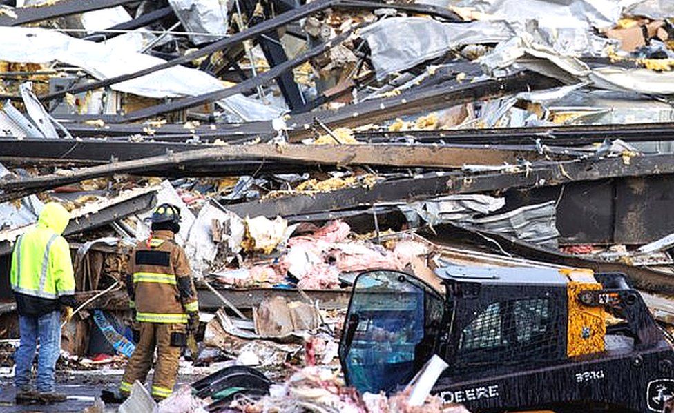 Rescuers search the Mayfield Consumer Products factory for survivors
