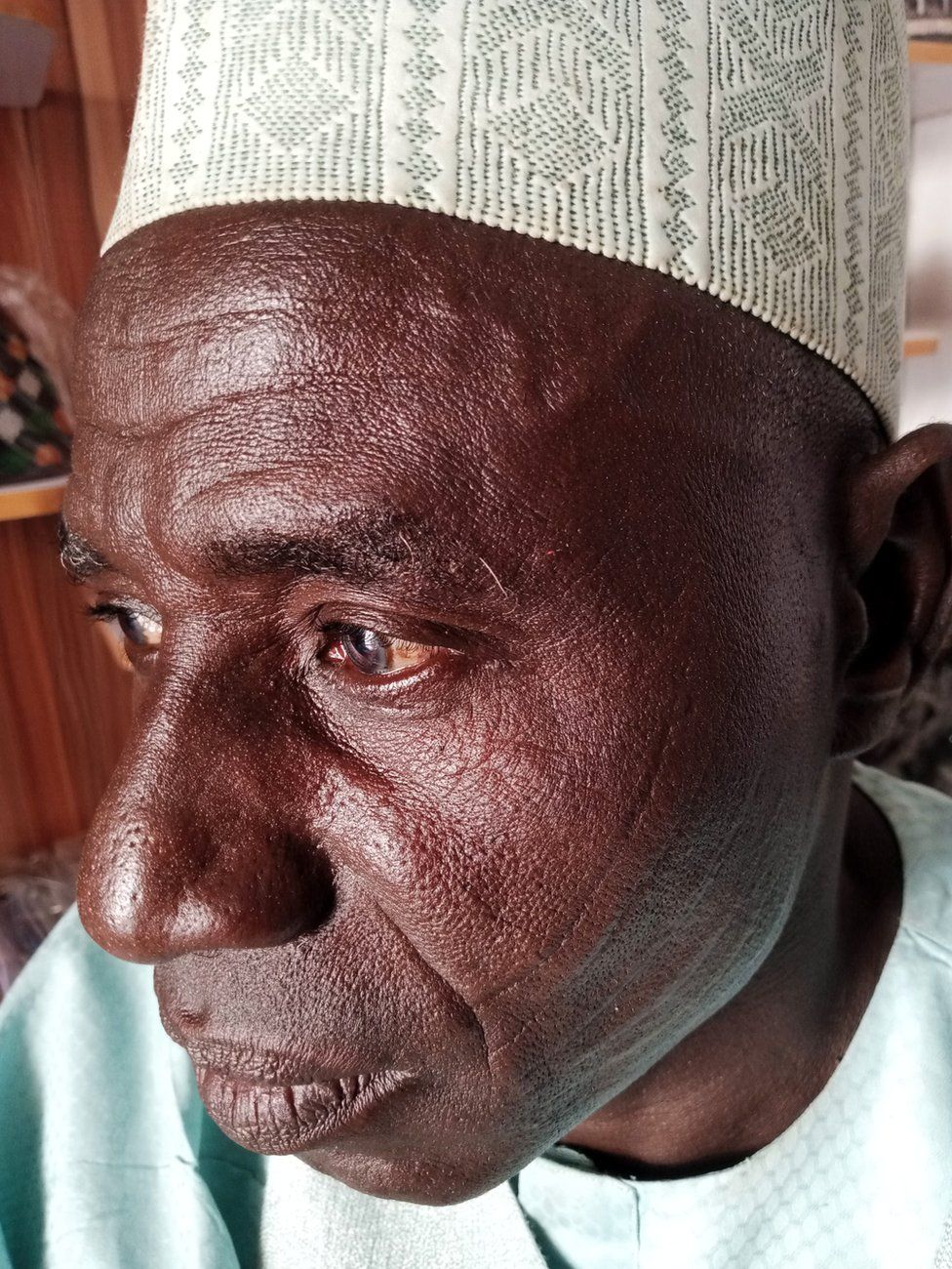 A man in traditional Hausa cap