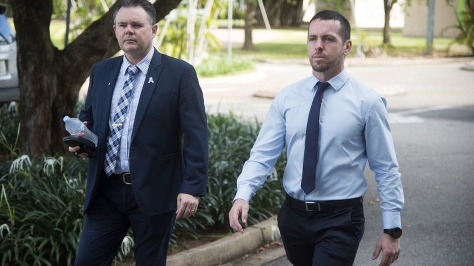 Constable Zachary Rolfe pictured with a union representative outside court