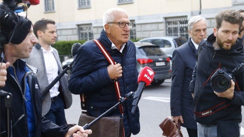Members of the media follow Pierin Vincenz, former CEO of Swiss Raiffeisen bank and his lawyer after a trial in Zurich, Switzerland April 13, 2022.