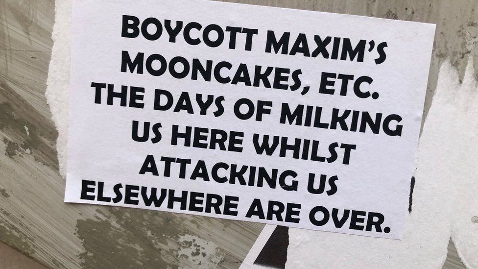 A sign saying Boycott Maxims Mooncakes etc, the days of milking us here while attacking us elsewhere are over.