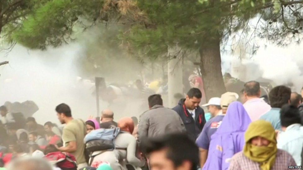 Macedonian police use tear gas on crowds of migrants at the southern border