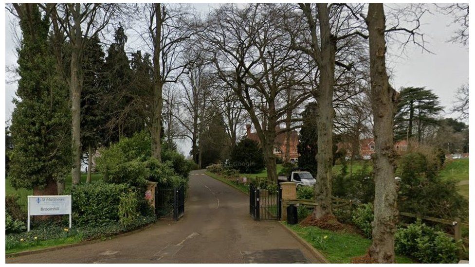 Main entrance to Broomhill, showing driveway with trees either side