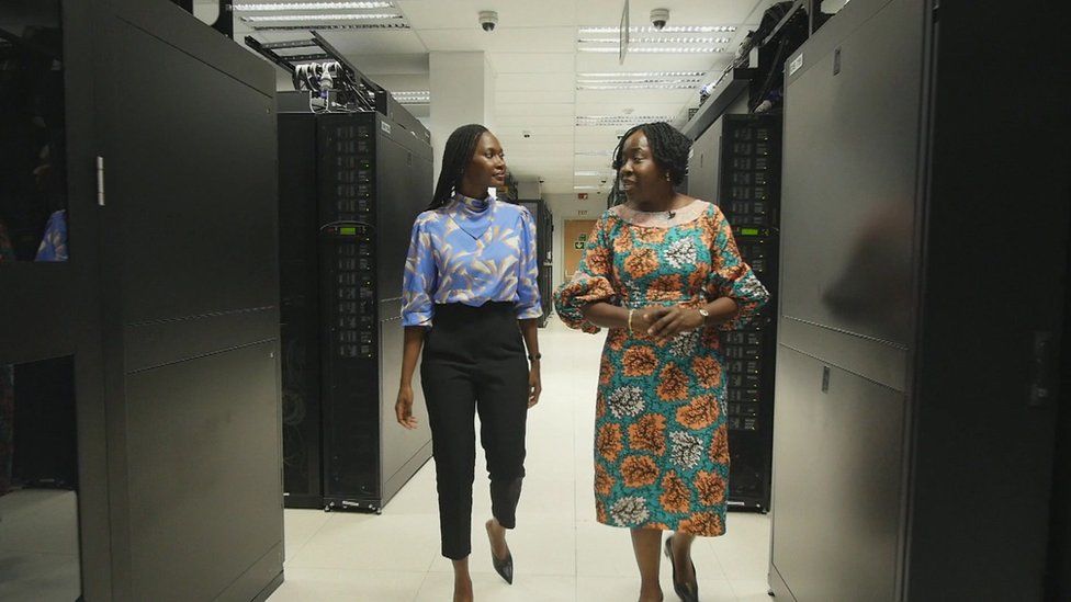 The BBC's Nancy Kacungira walks with Funke Opeke through MainOne's data centre in Lagos