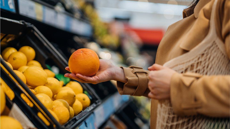 Woman food shopping - stock shot