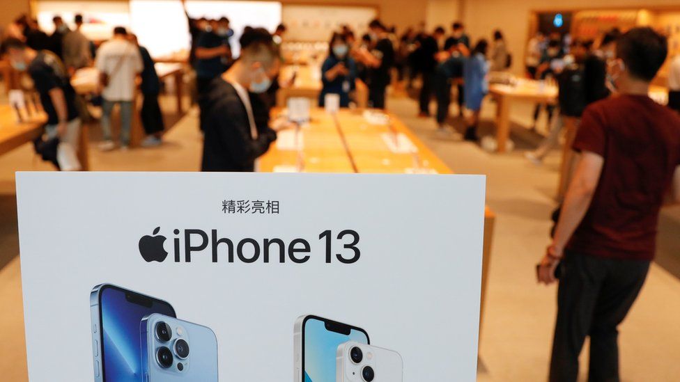 An iPhone 13 sign with Chinese lettering on display at a store in Beijing