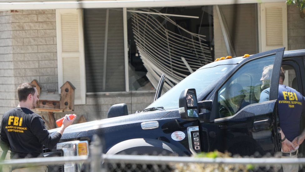 FBI agents process the home of Craig Robertson who was shot and killed by the FBI in a raid on his home this morning on August 9, 2023 in Provo, Utah