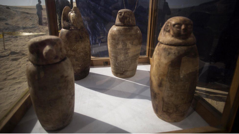 Four canopic jars, made of alabaster with lids bearing the faces of the four sons of god Horus, that were unearthed are displayed at the site of an ancient Egyptian cemetery, in Minya province, 245 km south of Cairo, Egypt.