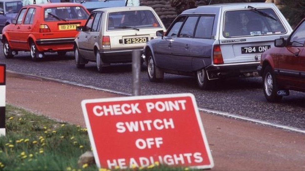 Cars at a vehicle checkpoint on the Irish border during the Northern Ireland Troubles