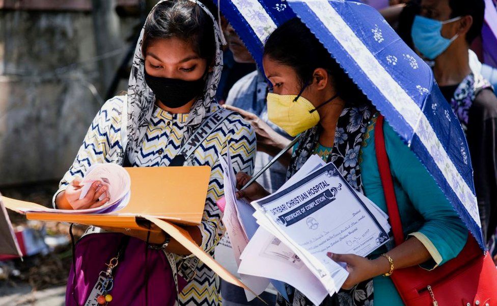 job applicants in queue to submit forms at Mahendra Mohan Choudhury Hospital (MMCH), during the ongoing COVID-19 lockdown, in Guwahati.