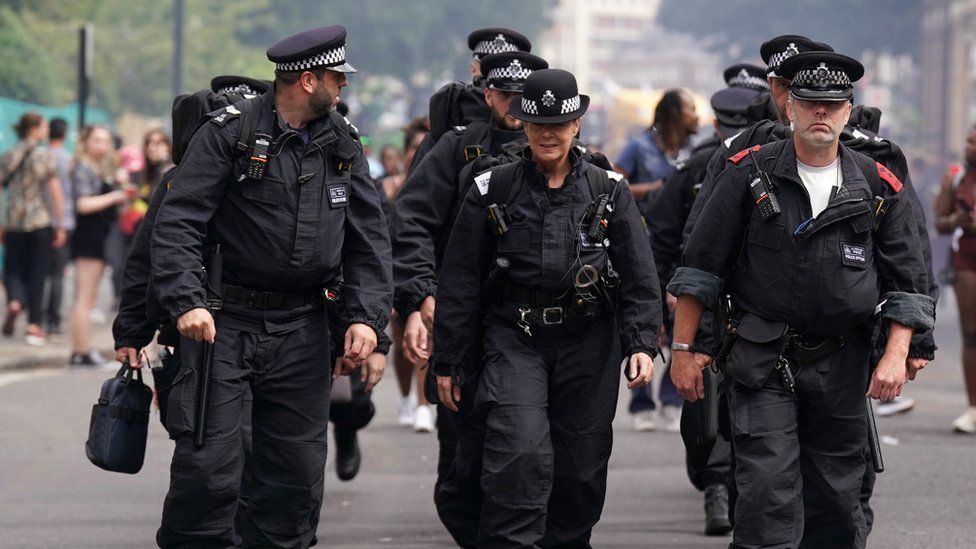 Police officers attending the Notting Hill Carnival in London, which returned to the streets for the first time in two years after it was thwarted by the pandemic.